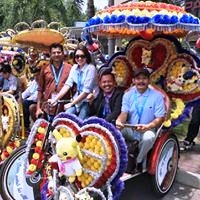 The delegates excited at the prospect of riding the decorated trishaws